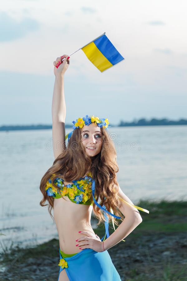 cute young brunette holding a Ukrainian flag