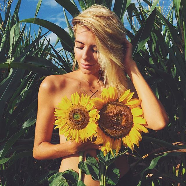 cute woman in field of sunflowers