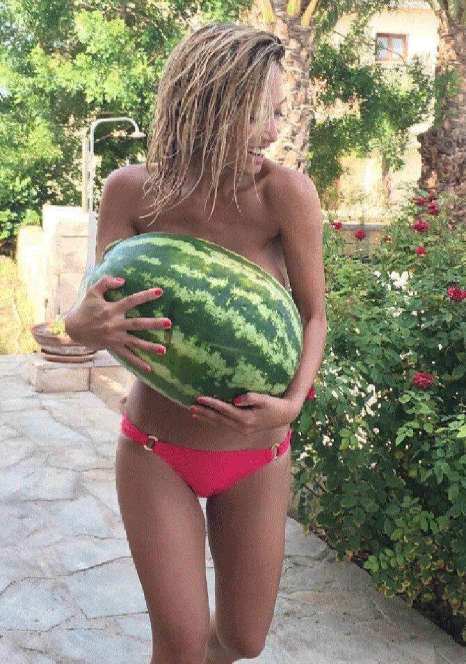 cute woman holding a watermelon