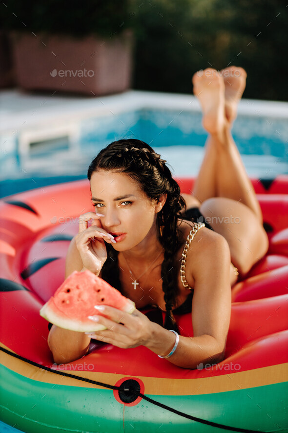 cute brunette holding watermelon