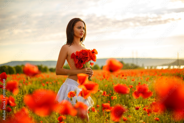 cute woman in field of poppies