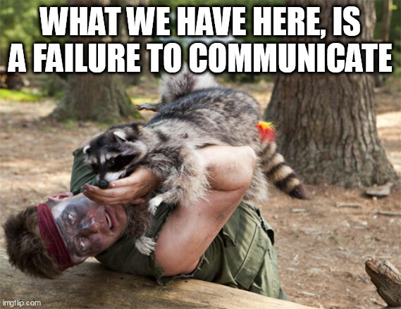 raccoon attacking a guy, captioned 'What we have here is a failure to communicate'