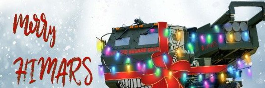 HIMARS decorated with Christmas lights and smiling nose art, 'Merry HIMARS'