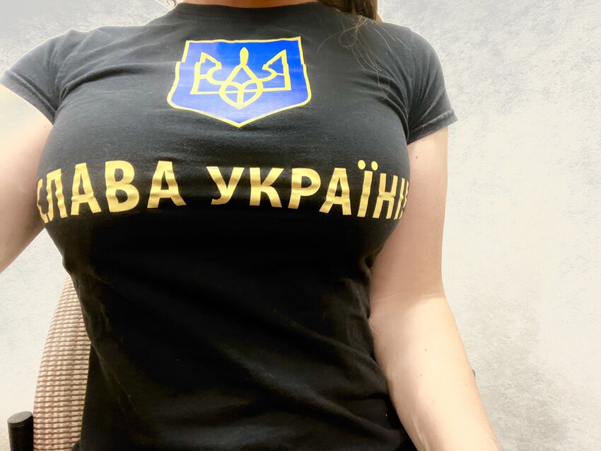cute woman in form-fitting 'Slava Ukraine' T-shirt