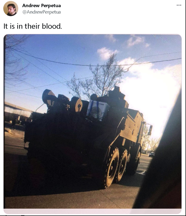 Russian recovery vehicle with a stolen washing machine strapped to it, captioned 'It is in their blood.'