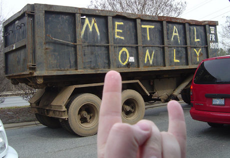 truck painted with 'Metal Only', someone throwing up the horns