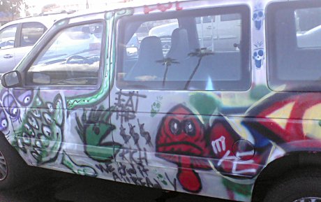 van with a bunch of amateur art on it