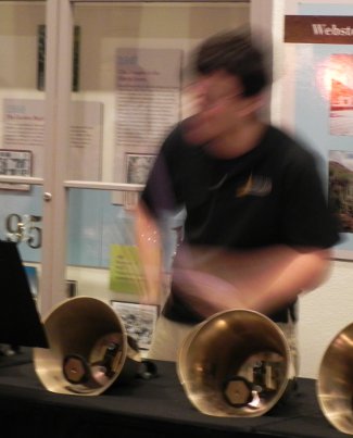 guy playing bells with sticks