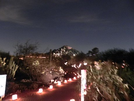 blurry photo of the lights on the mountainside at Luminarias