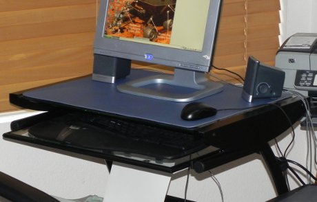 a brand new computer desk in black metal and glass