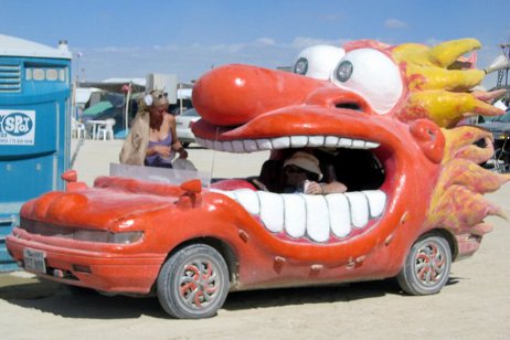 strange car that looks like a red cartoon person with an open mouth