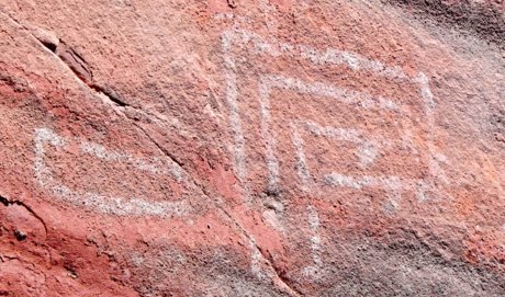 rectangular rock art in white on a cliff wall near Sedona