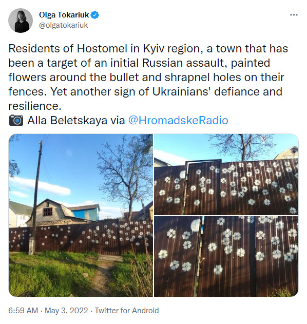 Residents of Hostomel painted flowers around the bullet and shrapnel holes on their fences.