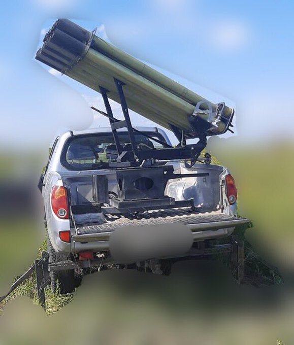 An MLRS system set up in the bed of a pickup truck, an 'MLRS technical' if you will