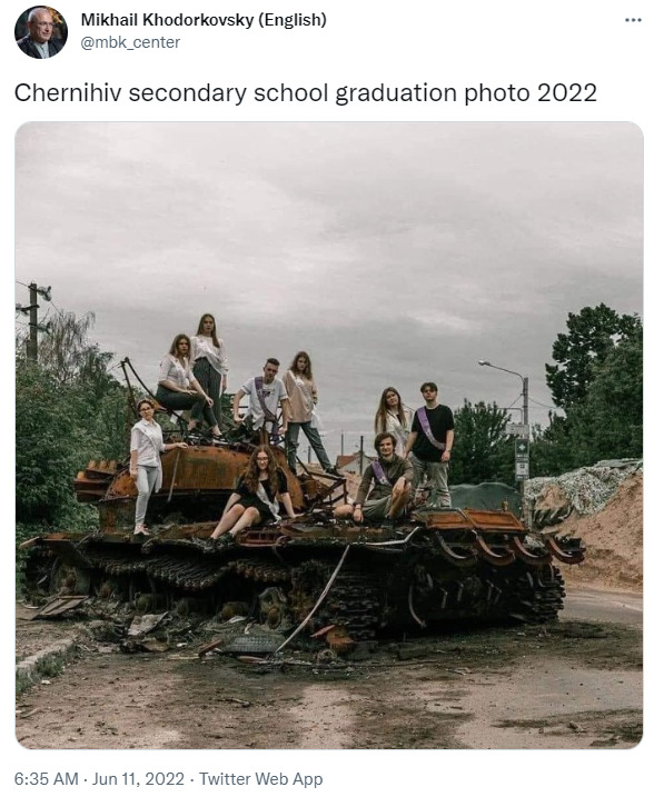 Chernihiv secondary school graduation photo 2022, graduating seniors on top of a Russian tank