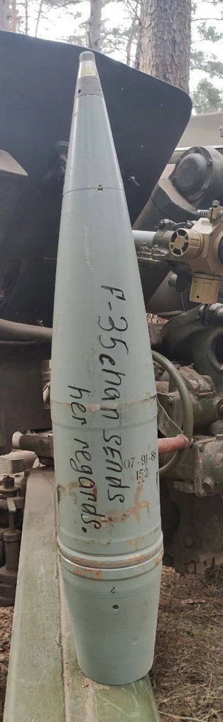 artillery shell with 'F-35chan sends her regards' written on it