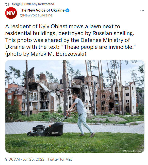 A resident of Kyiv Oblast mows a lawn next to residential buildings, destroyed by Russian shelling. This photo was shared by the Defense Ministry of Ukraine with the text: 'These people are invincible'