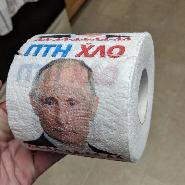 toilet paper with 'la-la-la-la, Putin is dickhead' and a picture of Putin's face
