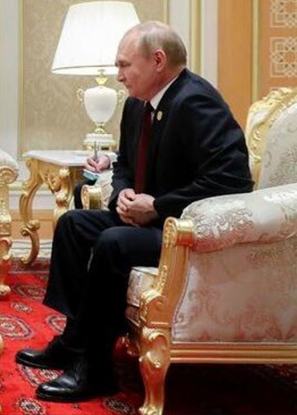 Putin on a couch looking distressed