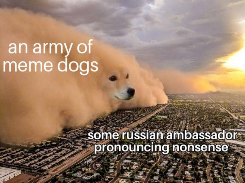 An army of meme dogs (a haboob with a dog head photoshopped onto it) advances on some Russian ambassador pronouncing nonsense (a city)