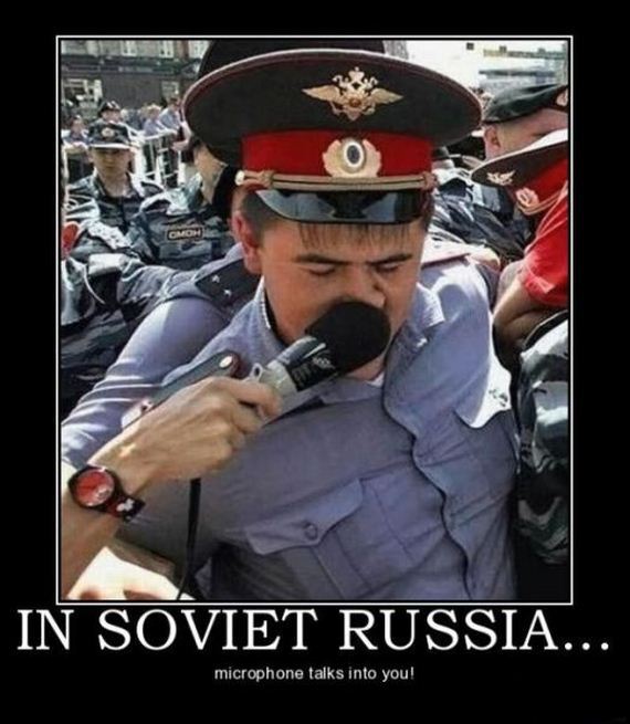 someone pushing a microphone into a Russian officer's nose, captioned 'In Soviet Russia, microphone talks into you!'