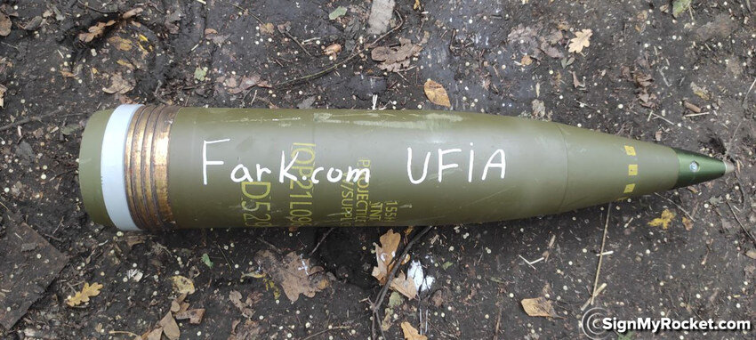 155mm shell with 'Fark.com UFIA' written on it