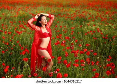 cute woman in red in field of poppies