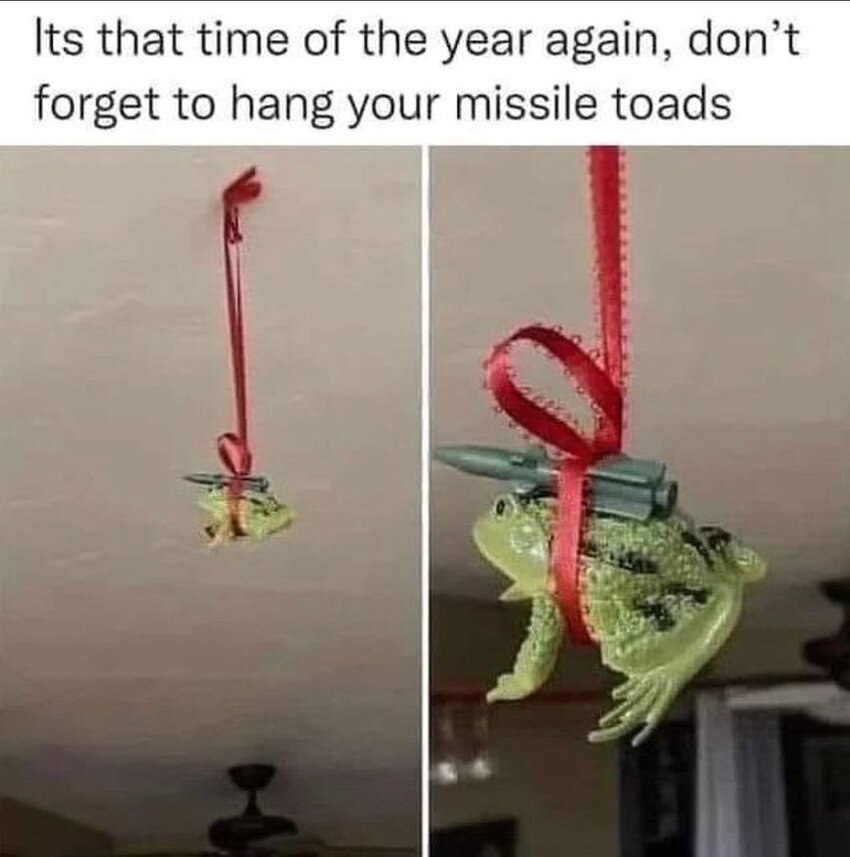 Don't forget to hang your missile toads. (A toy toad and a toy missile hang from a ribbon.)