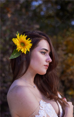 cute woman, sunflower in hair