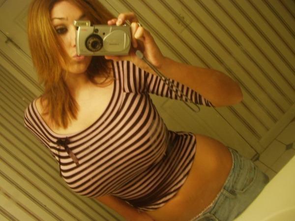 redhead taking picture in mirror