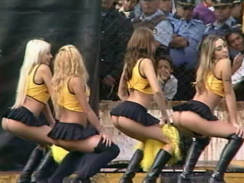 cheerleaders in yellow outfits boots and miniskirts