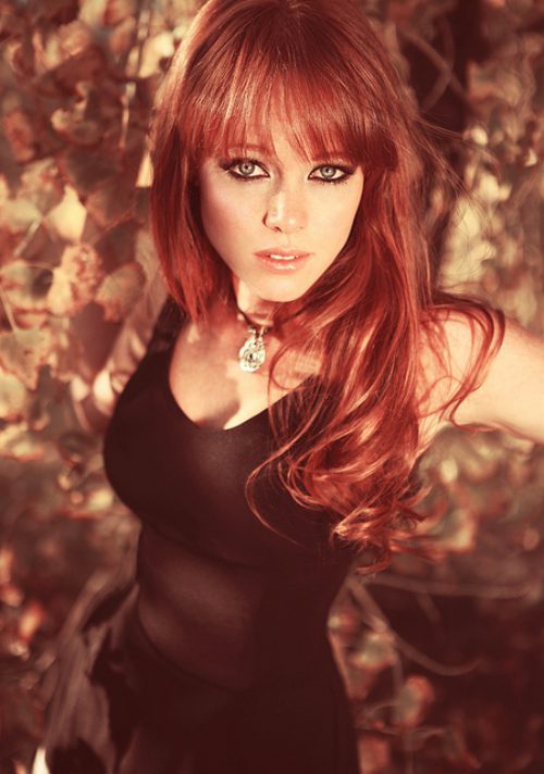 redhead in black dress