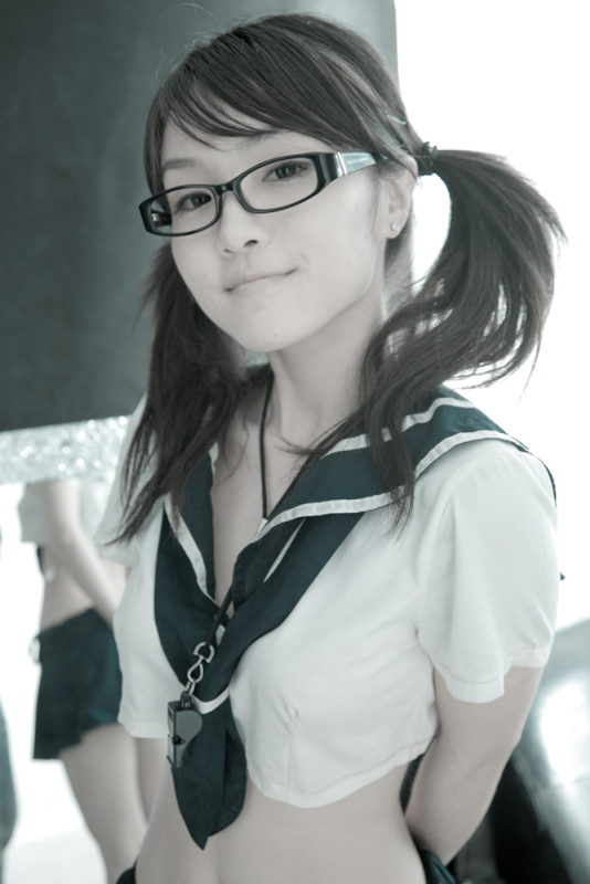 woman with glasses in Japanese schoolgirl outfit