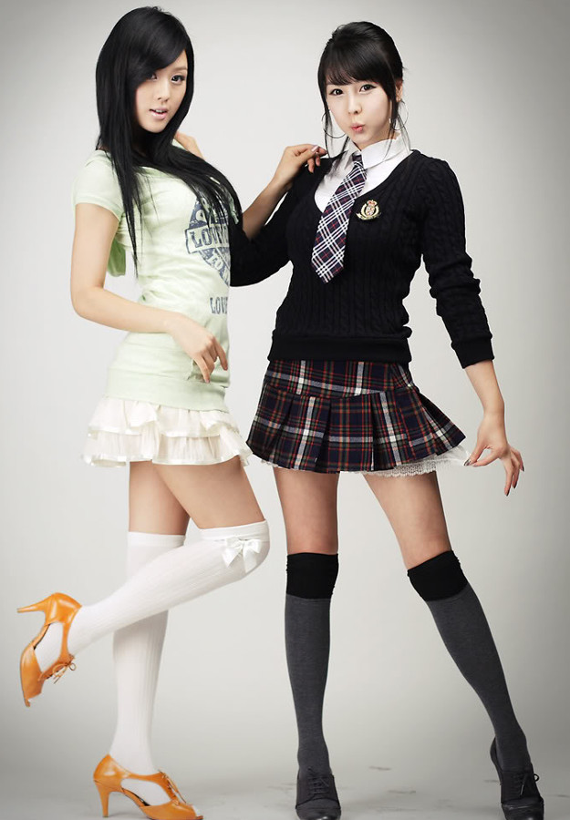 women in Japanese schoolgirl outfits