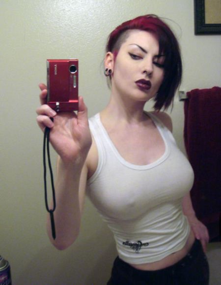 punk brunette in white top with nipples poking out