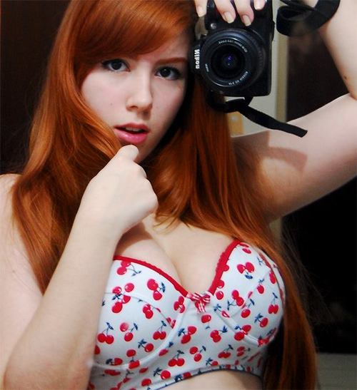 redhead with a camera